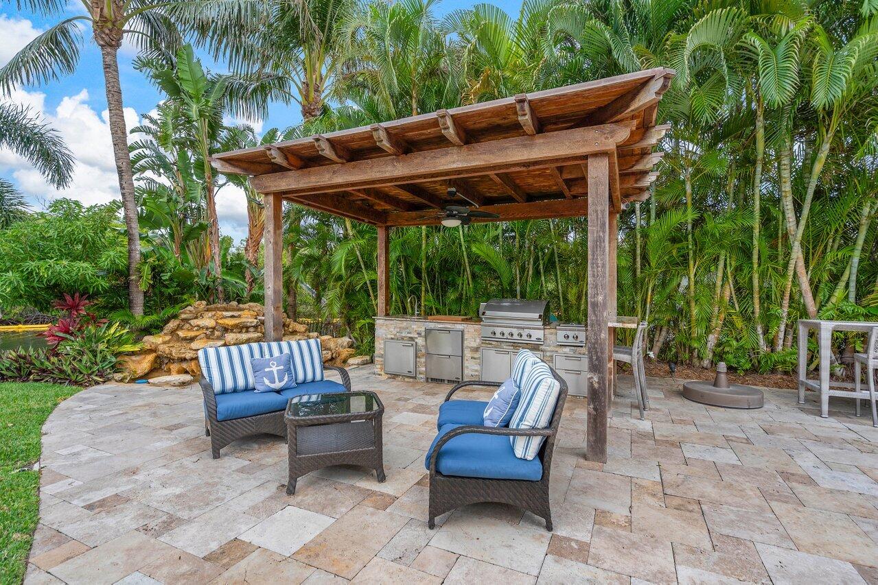 601 Phillips Drive Boca Raton, FL 33432 - Photo 37 of 56 a patio view with a seating space
