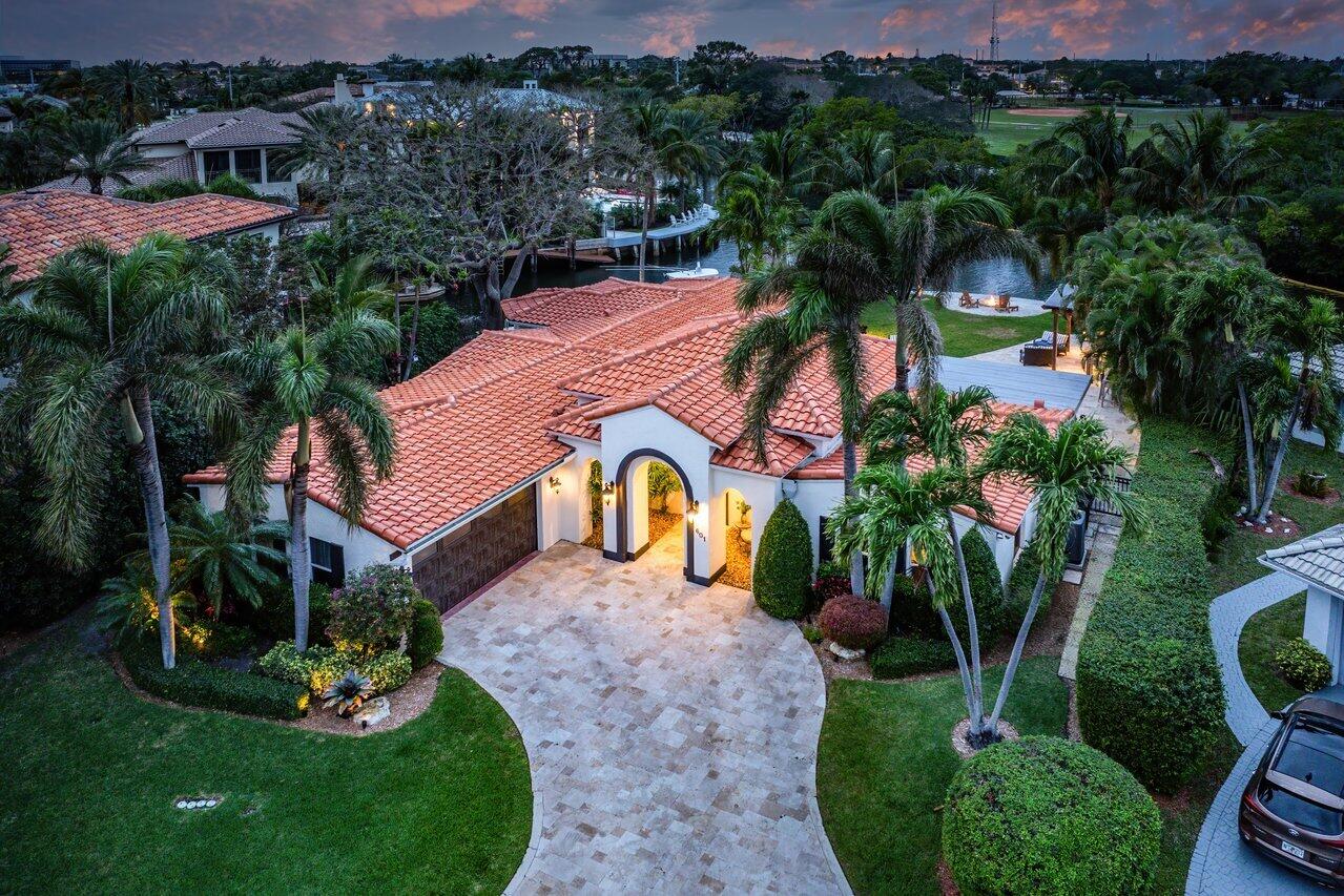 601 Phillips Drive Boca Raton, FL 33432 - Photo 56 of 56 a aerial view of a house with garden space and trees all around