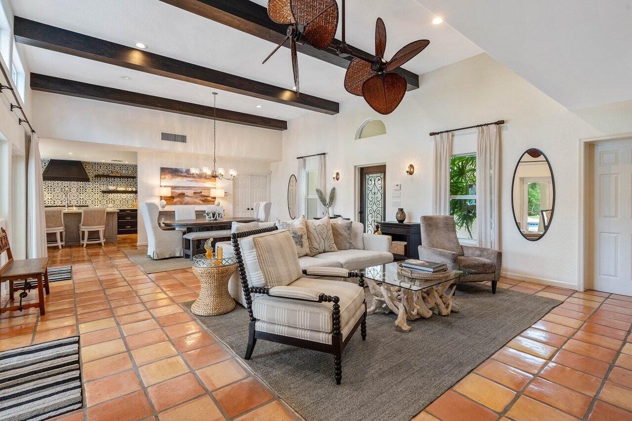 601 Phillips Drive Boca Raton, FL 33432 - Photo 7 of 56 a living room with lots of furniture a rug and a clock