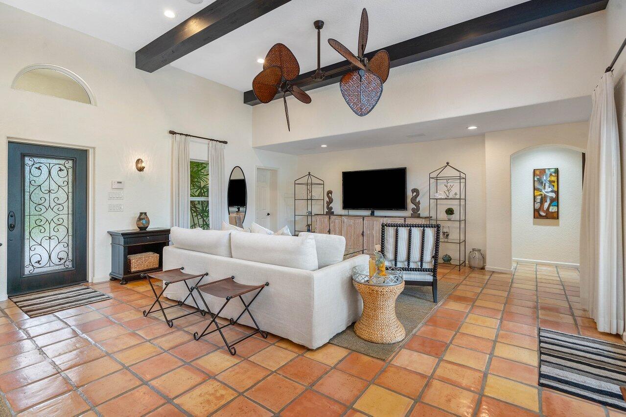 601 Phillips Drive Boca Raton, FL 33432 - Photo 8 of 56 a living room with furniture and a flat screen tv