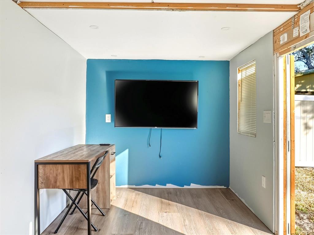 1017 Rosedale Road Venice, FL 34293 - Photo 23 of 30 a living room with a flat screen tv and a fireplace