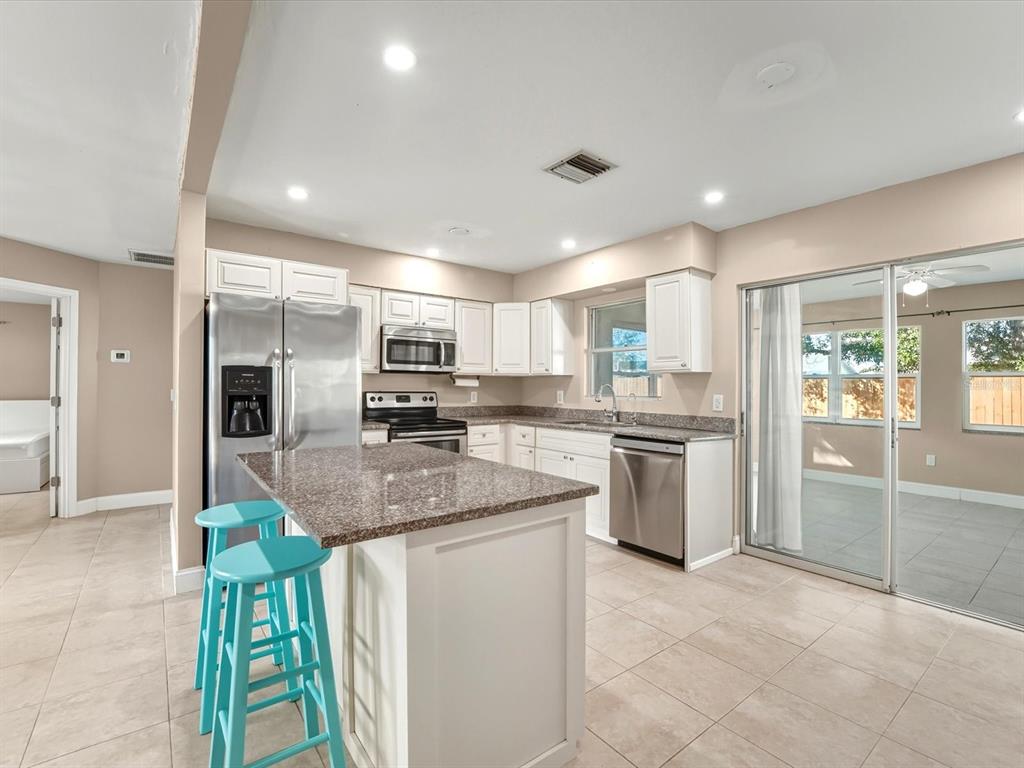 1017 Rosedale Road Venice, FL 34293 - Photo 4 of 30 a kitchen with refrigerator and window