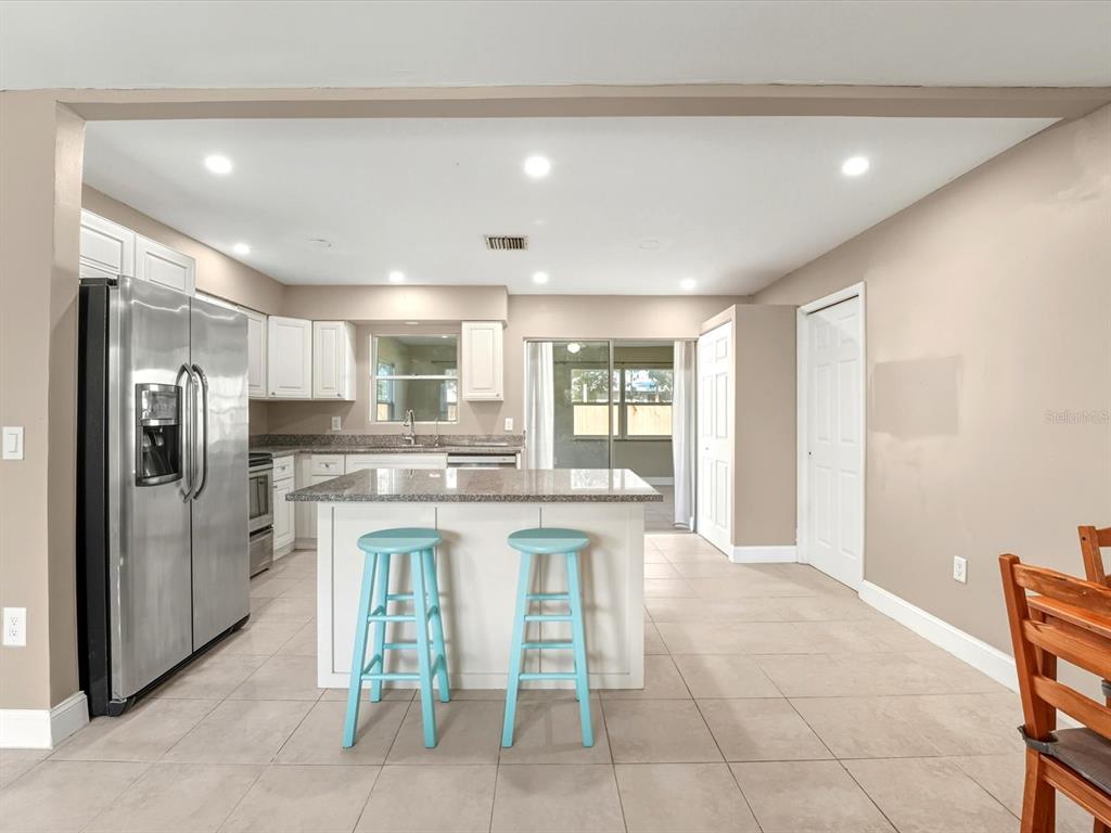 1017 Rosedale Road Venice, FL 34293 - Photo 7 of 30 a kitchen with stainless steel appliances granite countertop a refrigerator and a sink