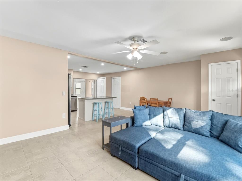 1017 Rosedale Road Venice, FL 34293 - Photo 9 of 30 a living room with furniture and a chandelier