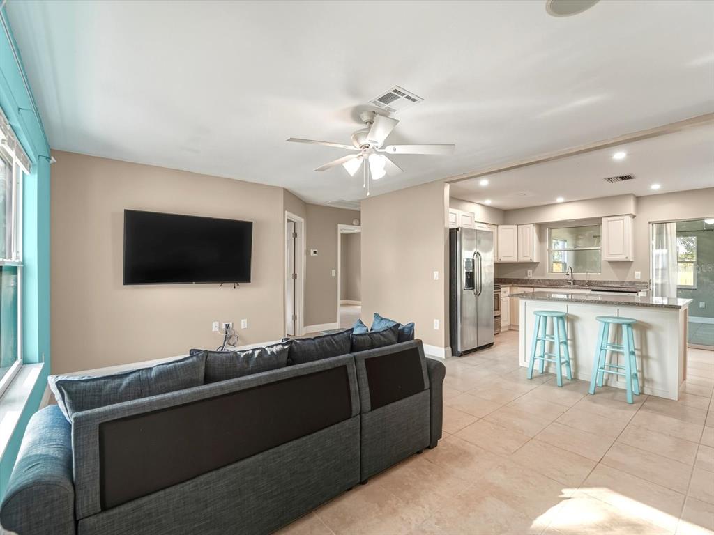 1017 Rosedale Road Venice, FL 34293 - Photo 10 of 30 a living room with furniture and a flat screen tv