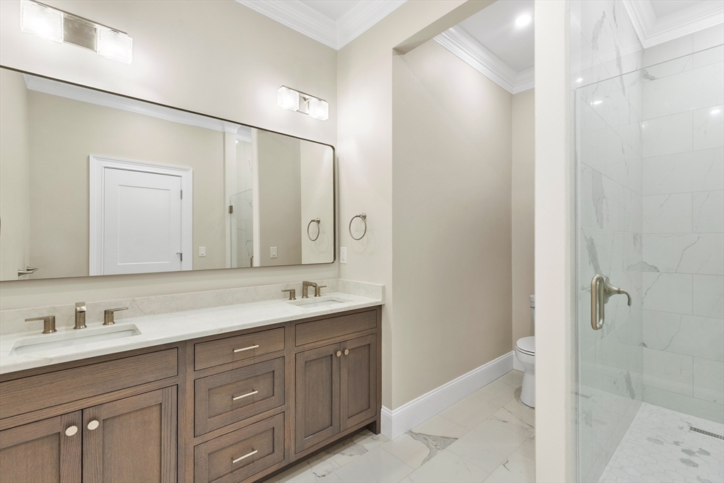 320 Concord Avenue Lexington, MA 02421 - Photo 18 of 40 a bathroom with a granite countertop sink mirror and double