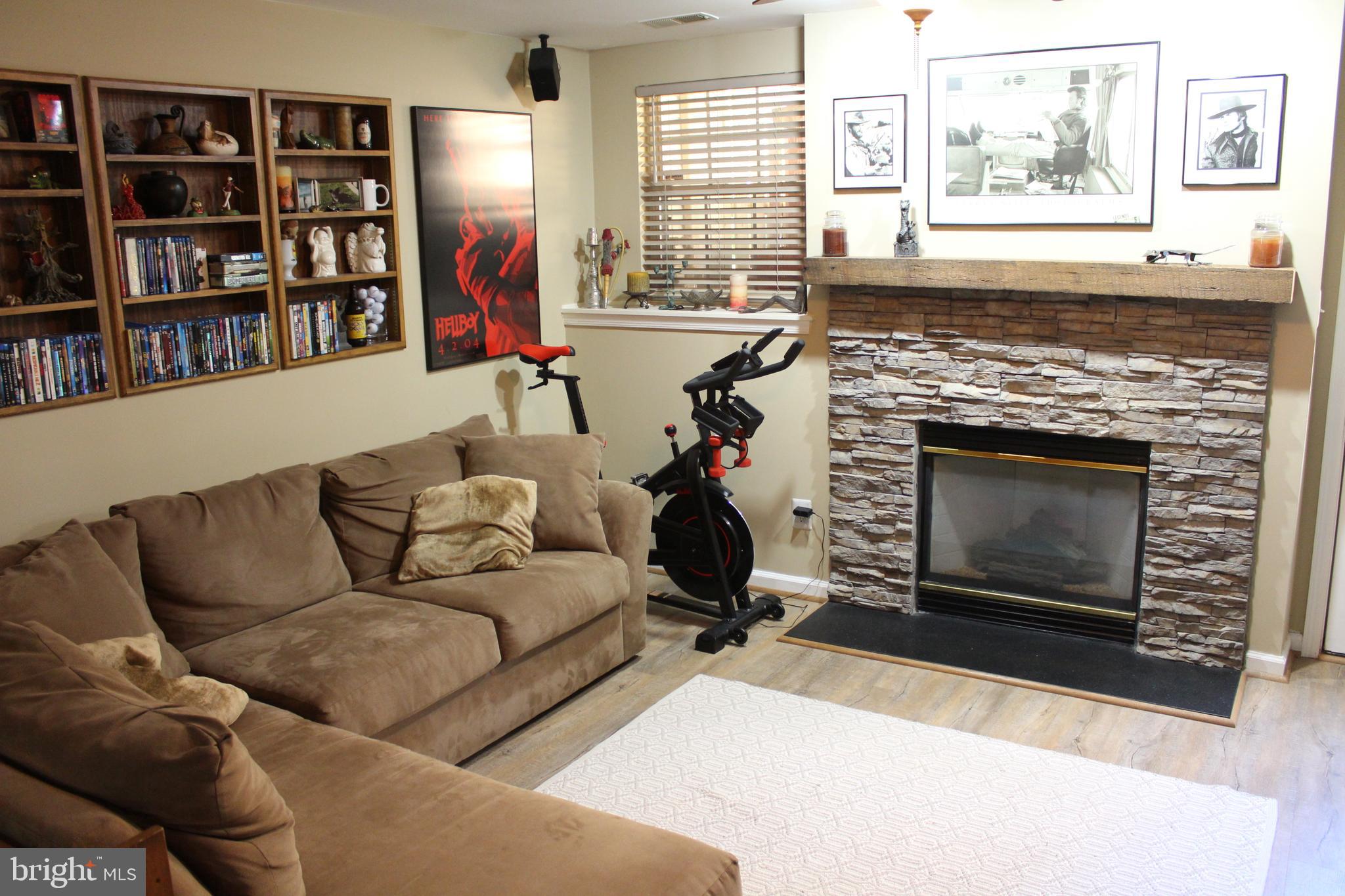 14152 Asher View Centreville, VA 20121 - Photo 21 of 34 Lower level family room with gas fireplace