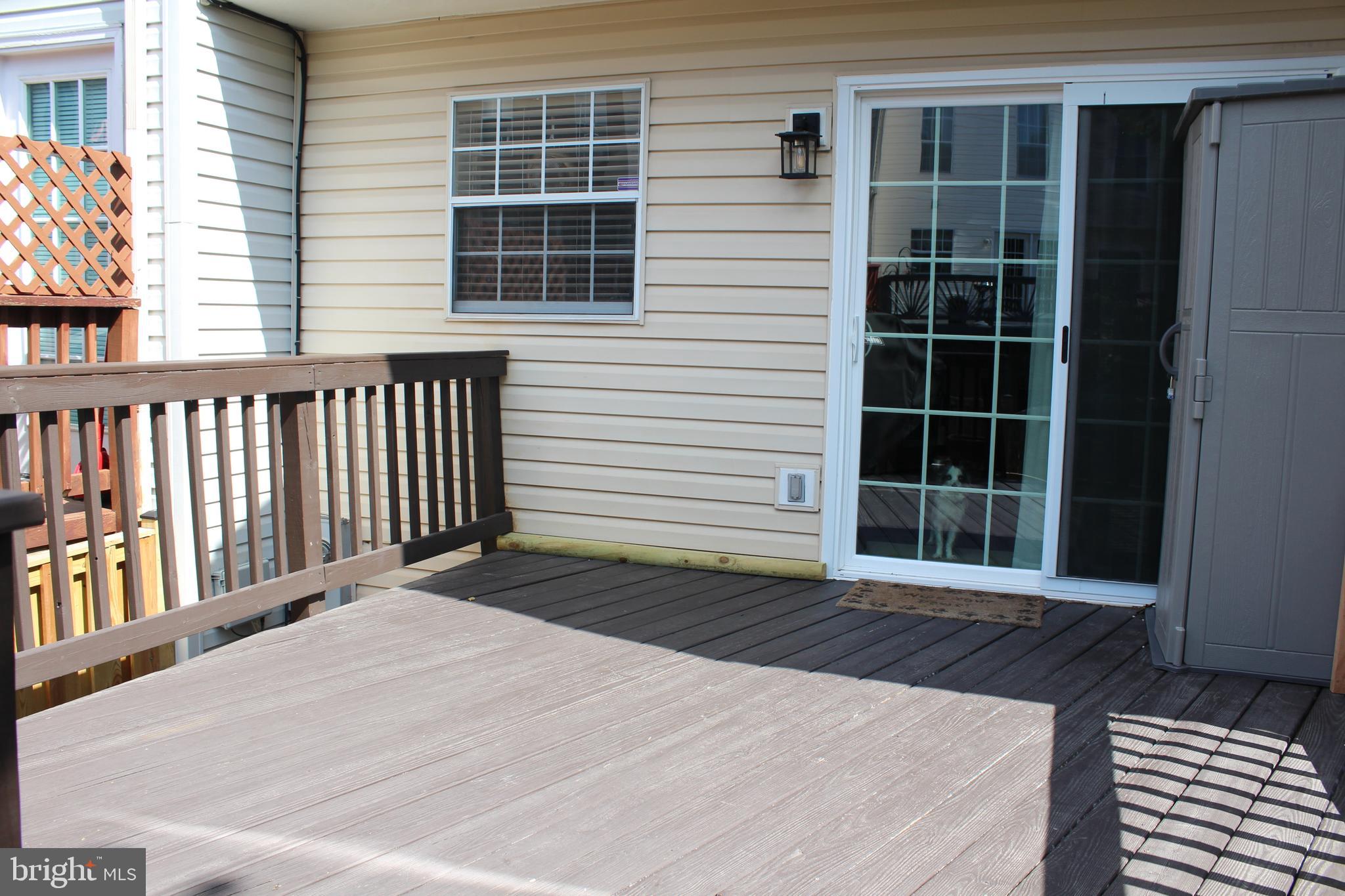 14152 Asher View Centreville, VA 20121 - Photo 31 of 34 Rear deck sliding glass doors with K9 lookout!