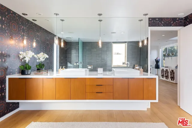 a large pool with table and chairs