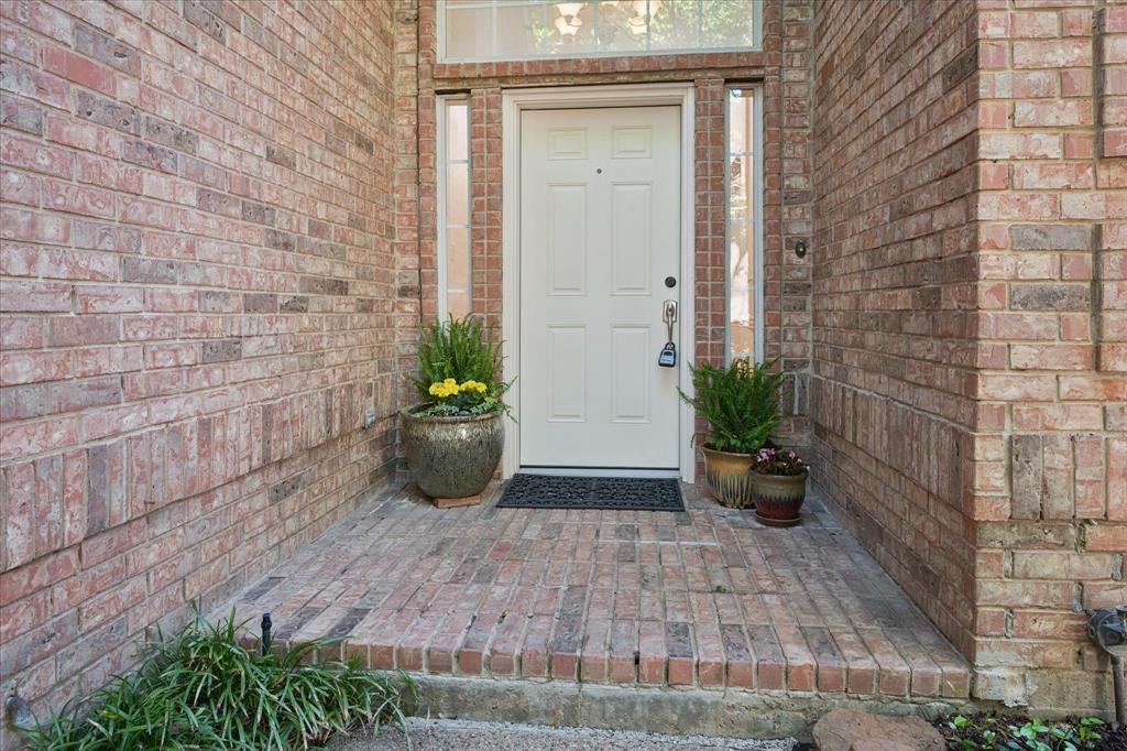 14592 Greenleaf Court Addison, TX 75001 - Photo 22 of 34 Property entrance featuring brick siding