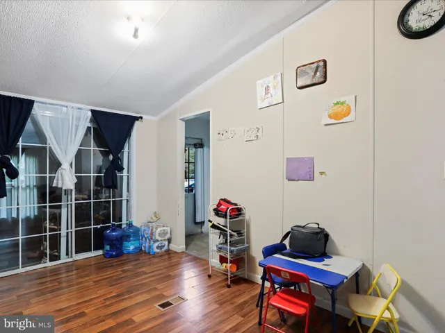 a living room with furniture and white walls