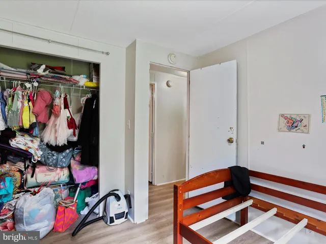 a living room with furniture and a gym equipment
