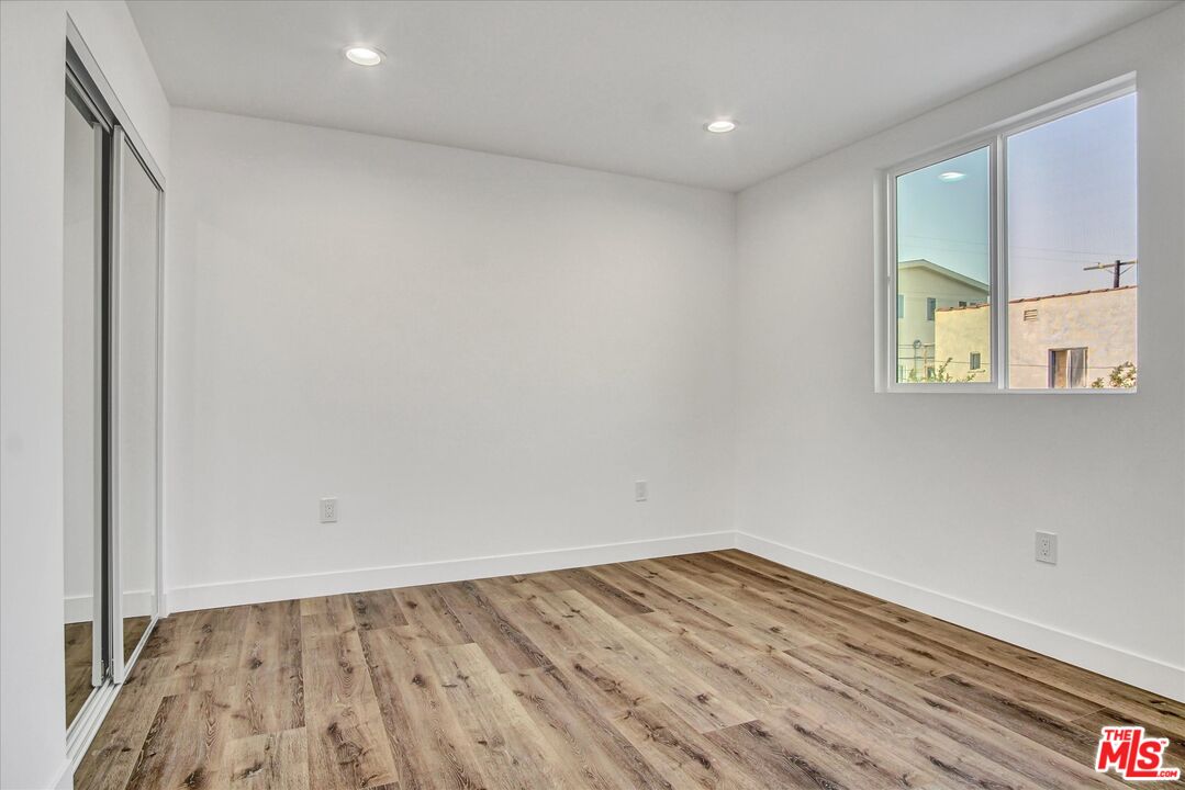 2419 South Cochran Avenue Los Angeles, CA 90016 - Photo 22 of 74 wooden floor in an empty room