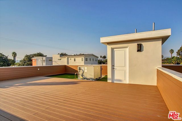 a kitchen with stainless steel appliances a refrigerator sink and microwave