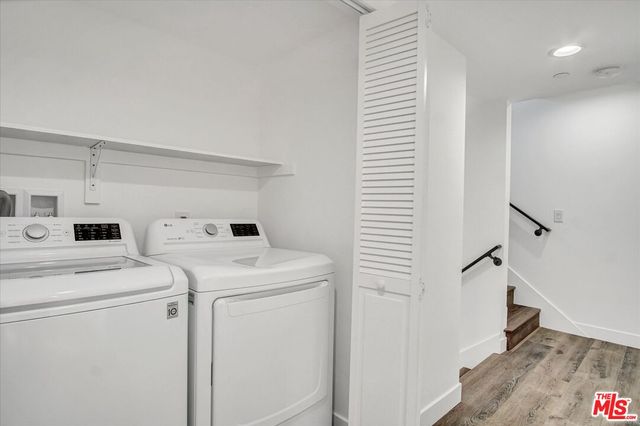a view of a bathroom with wooden floor