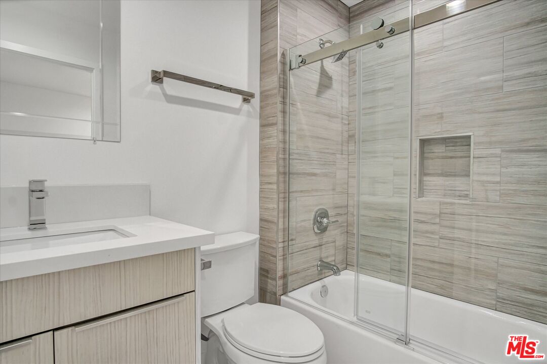 2419 South Cochran Avenue Los Angeles, CA 90016 - Photo 49 of 74 a bathroom with a sink toilet and shower