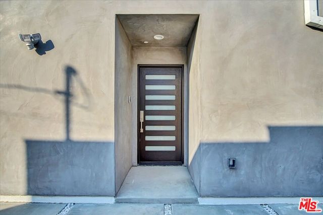 a view of a kitchen with wooden floor and a sink