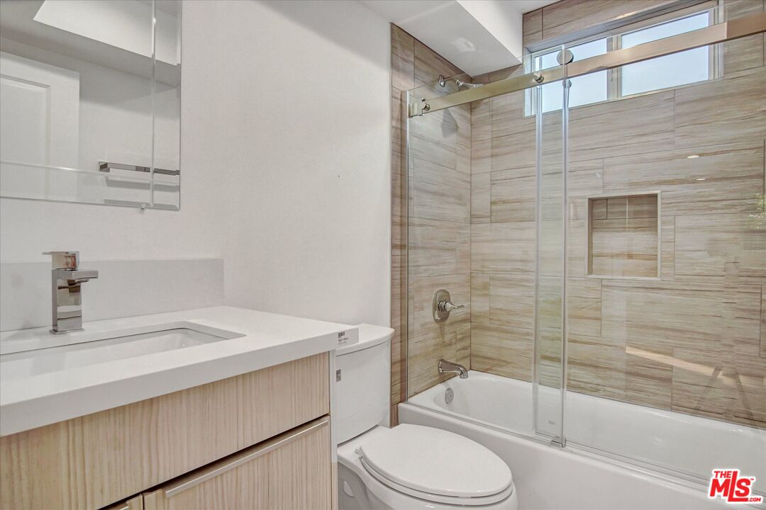 2419 South Cochran Avenue Los Angeles, CA 90016 - Photo 68 of 74 a bathroom with a sink a toilet and shower