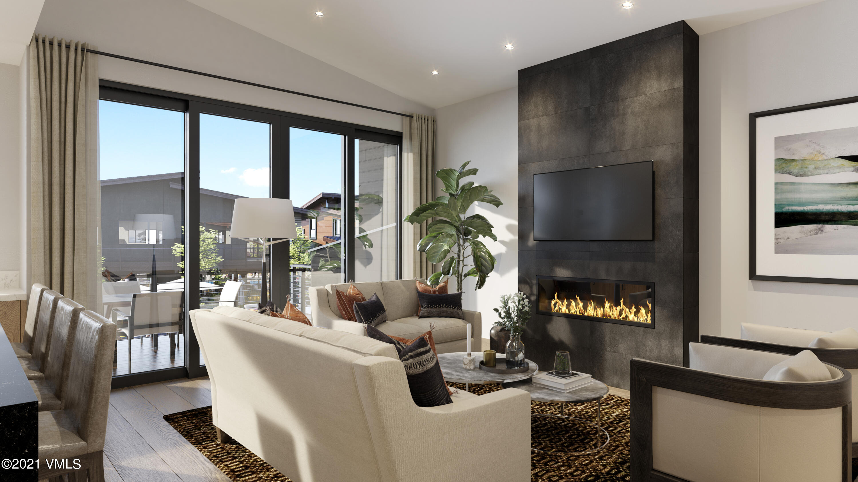 42 Riverfront Lane, Unit 10 Avon, CO 81620 - Photo 3 of 4 a living room with fireplace furniture and a floor to ceiling window