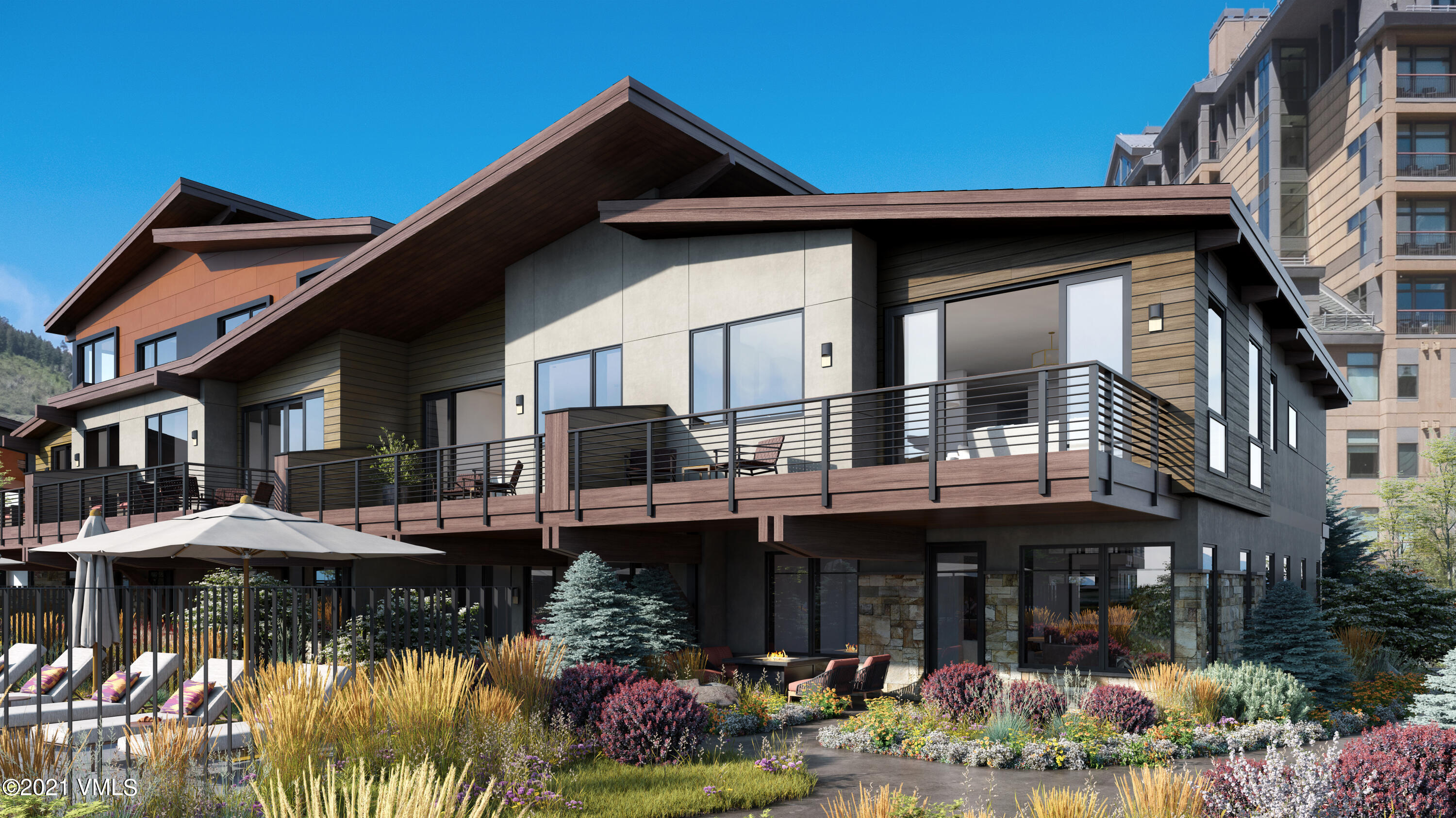 42 Riverfront Lane, Unit 10 Avon, CO 81620 - Photo 4 of 4 a front view of a house with swimming pool and glass windows