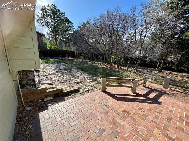 280 Raven Hills Road Colorado Springs, CO 80919 - Photo 13 of 48 View of patio / terrace featuring fence
