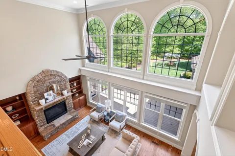 an aerial view of a house with a garden and trees