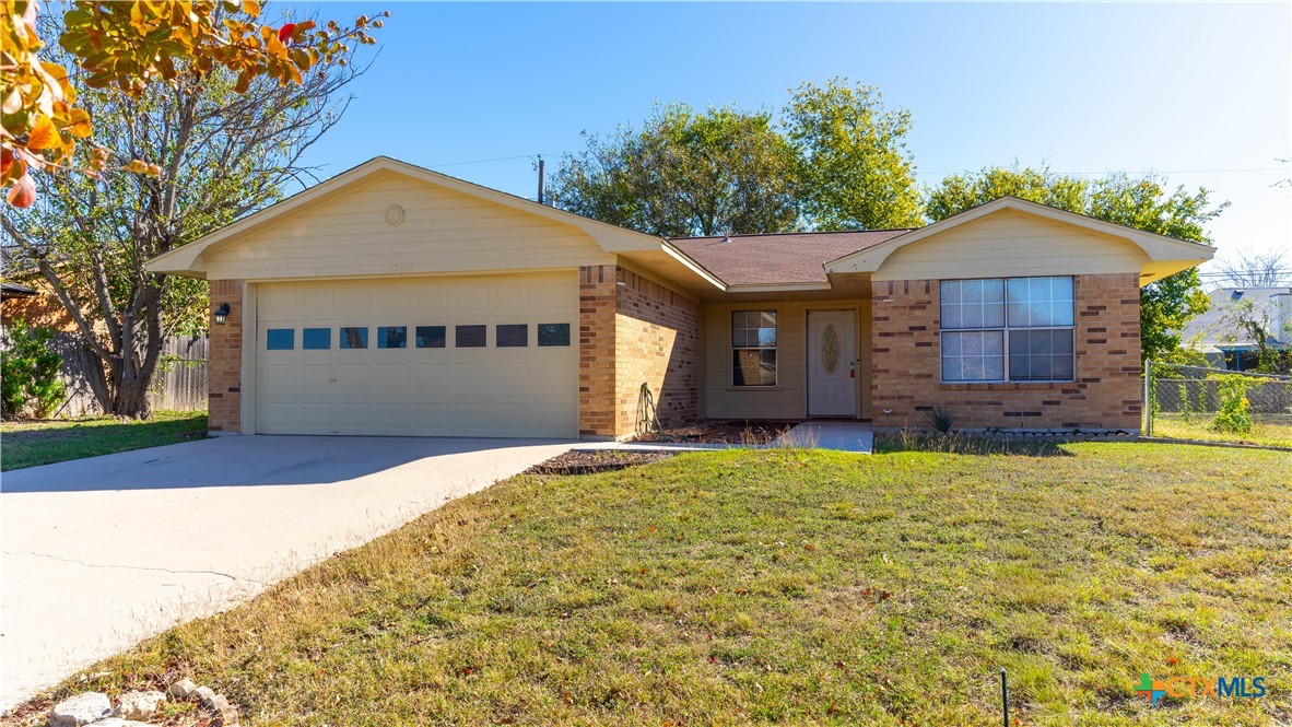 2402 Lazy Ridge Drive Killeen, TX 76543 - Photo 1 of 16 a front view of a house with a yard