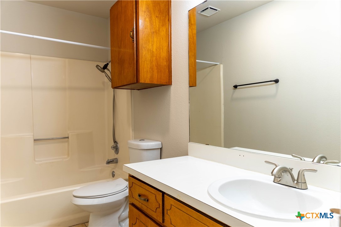 2402 Lazy Ridge Drive Killeen, TX 76543 - Photo 8 of 16 a bathroom with a sink toilet and shower