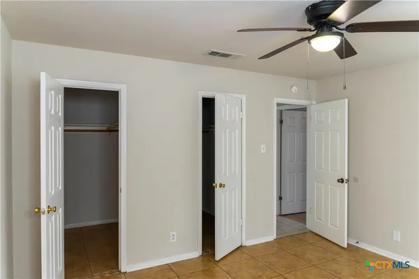 an empty room with a empty space and a window