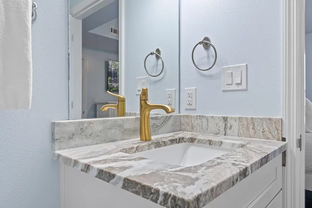 a bathroom with a sink and a shower