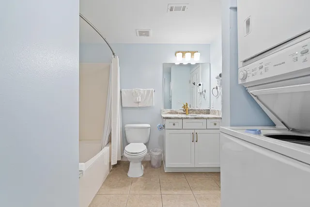 a view of bathroom with a washer and dryer