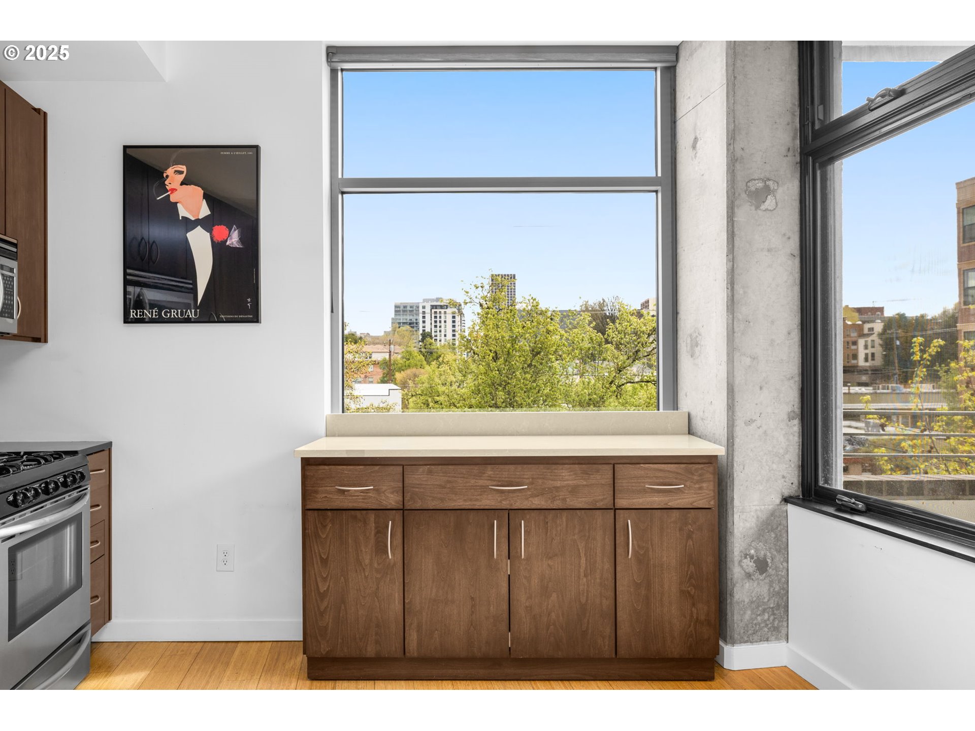 1234 Southwest 18th Avenue, Unit 305 Portland, OR 97205 - Photo 14 of 31 a open kitchen with a sink a stove and a refrigerator
