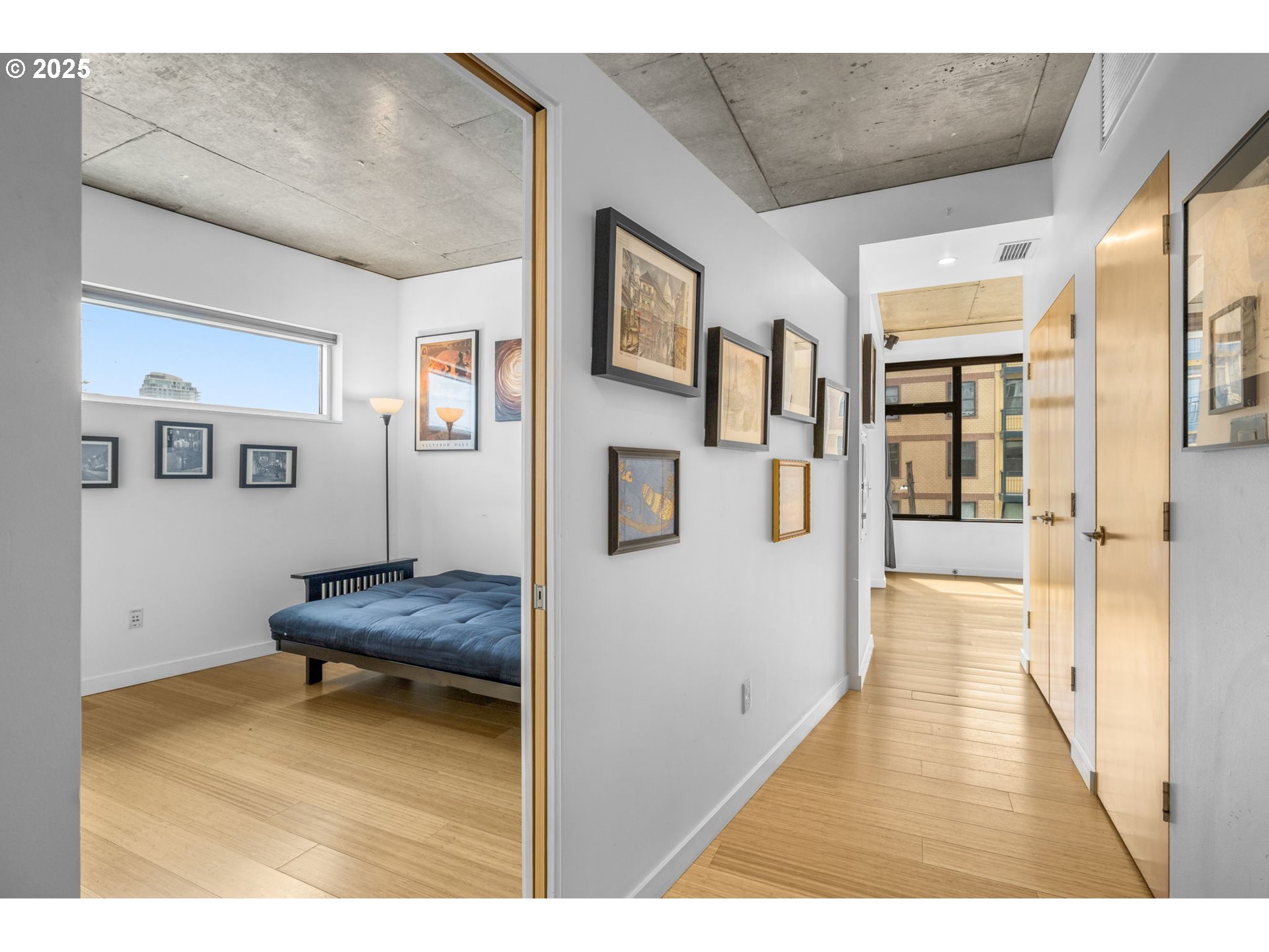 1234 Southwest 18th Avenue, Unit 305 Portland, OR 97205 - Photo 15 of 31 a hallway with wooden floor and furniture