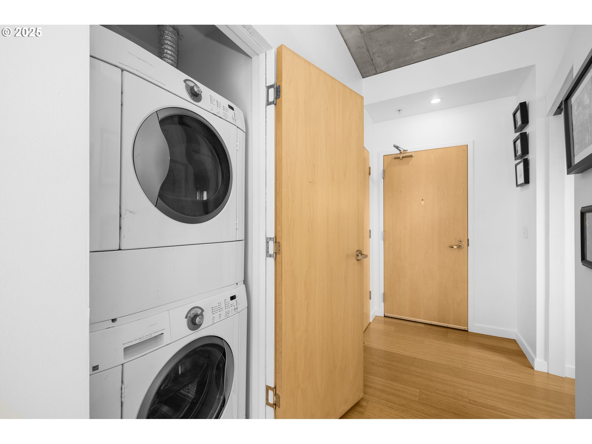 1234 Southwest 18th Avenue, Unit 305 Portland, OR 97205 - Photo 22 of 31 a view of a hallway with washer and dryer