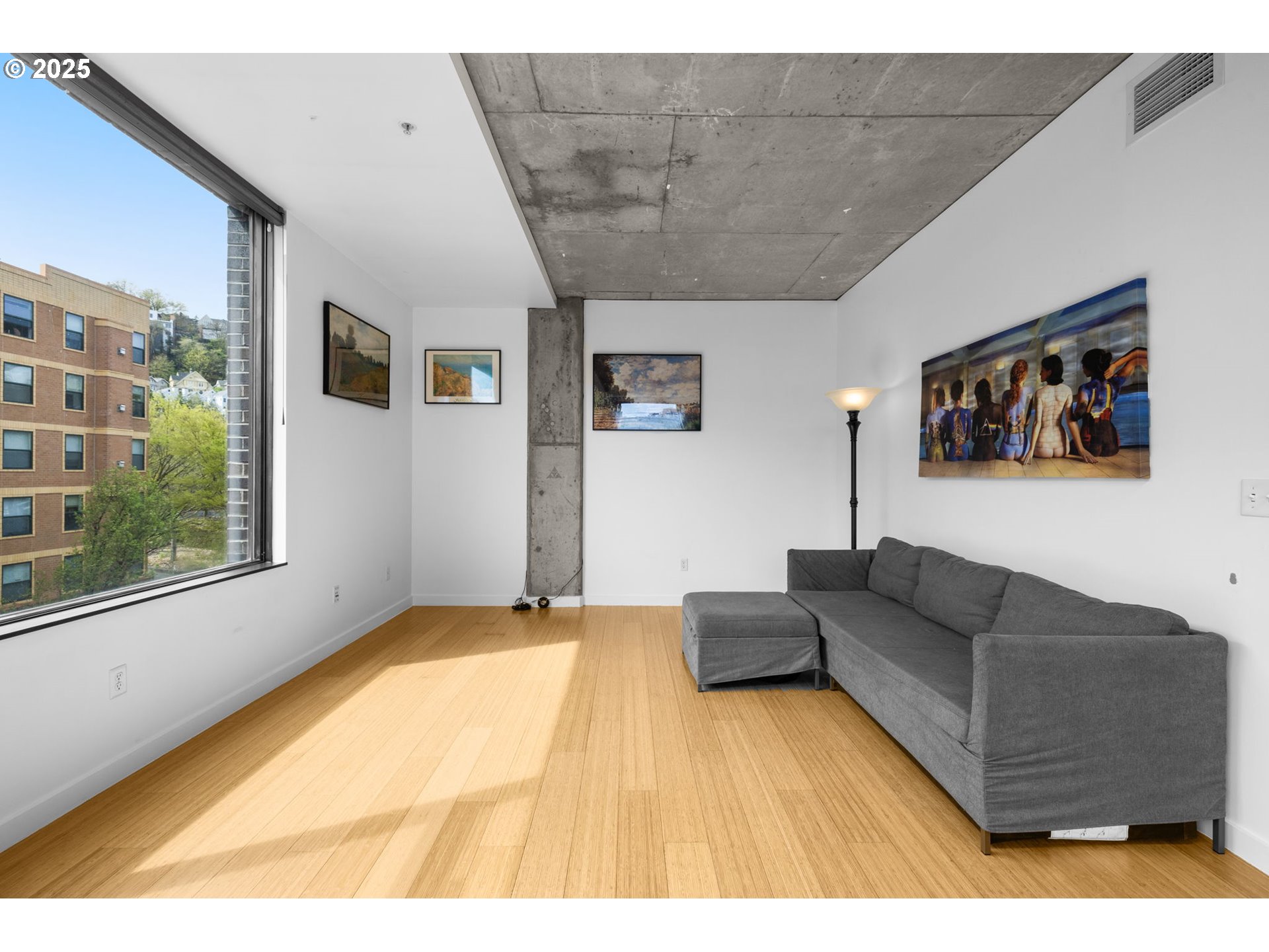 1234 Southwest 18th Avenue, Unit 305 Portland, OR 97205 - Photo 6 of 31 a living room with couches and painting on the wall
