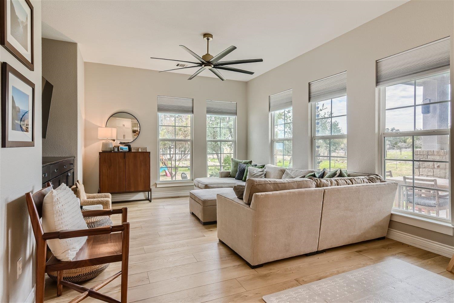 113 Vista View Trail Spicewood, TX 78669 - Photo 14 of 30 a living room with furniture and floor to ceiling windows