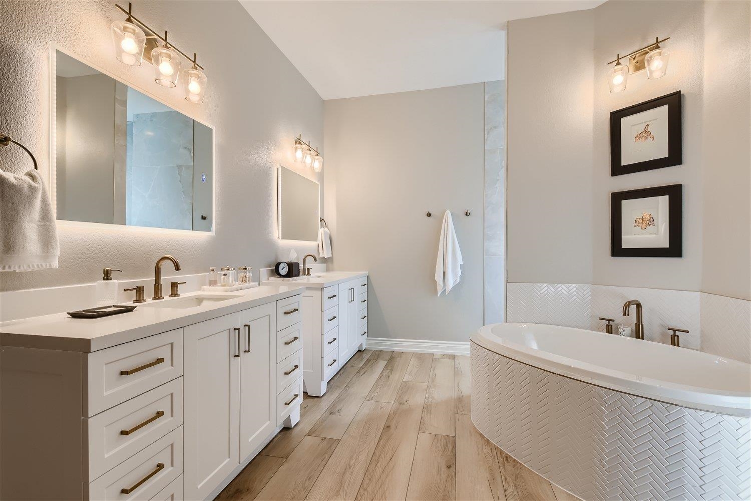 113 Vista View Trail Spicewood, TX 78669 - Photo 17 of 30 a bathroom with a double vanity sink a mirror a vanity and a