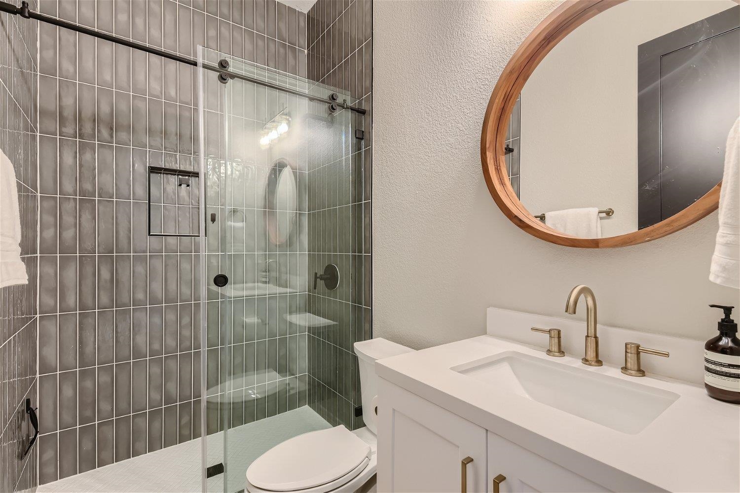 113 Vista View Trail Spicewood, TX 78669 - Photo 22 of 30 a bathroom with a sink toilet and shower