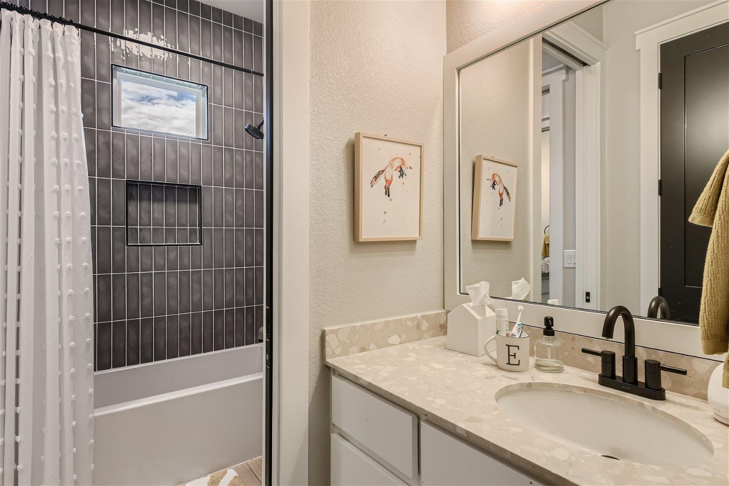 113 Vista View Trail Spicewood, TX 78669 - Photo 24 of 30 a bathroom with a granite countertop sink a mirror and shower