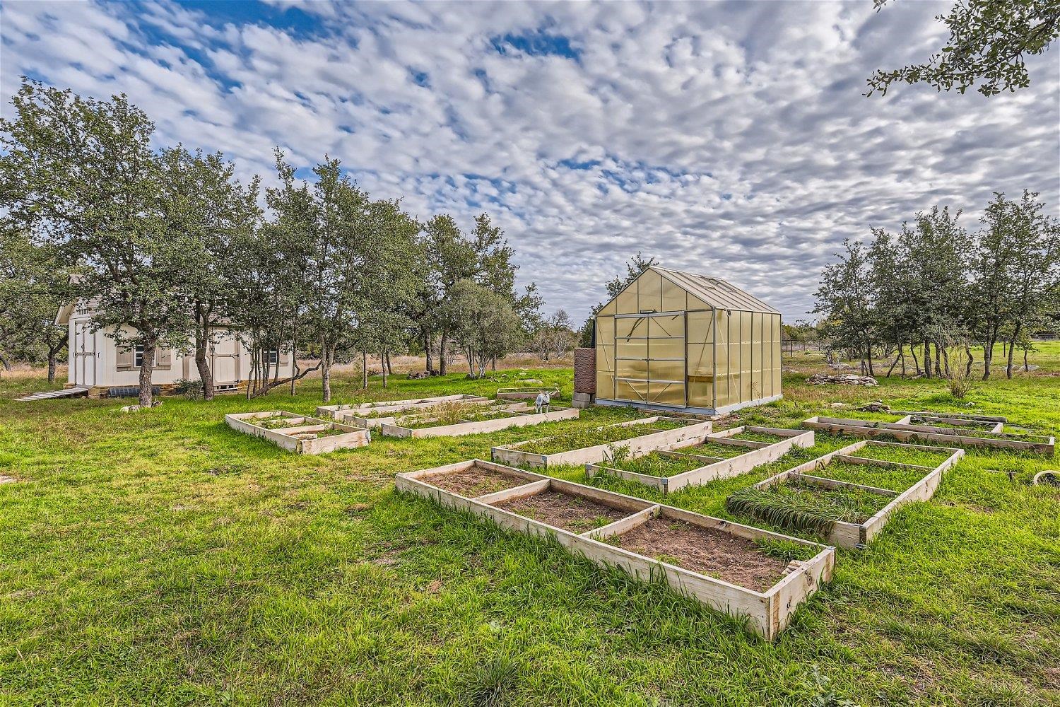 113 Vista View Trail Spicewood, TX 78669 - Photo 28 of 30 a view of a house with swimming pool and a yard