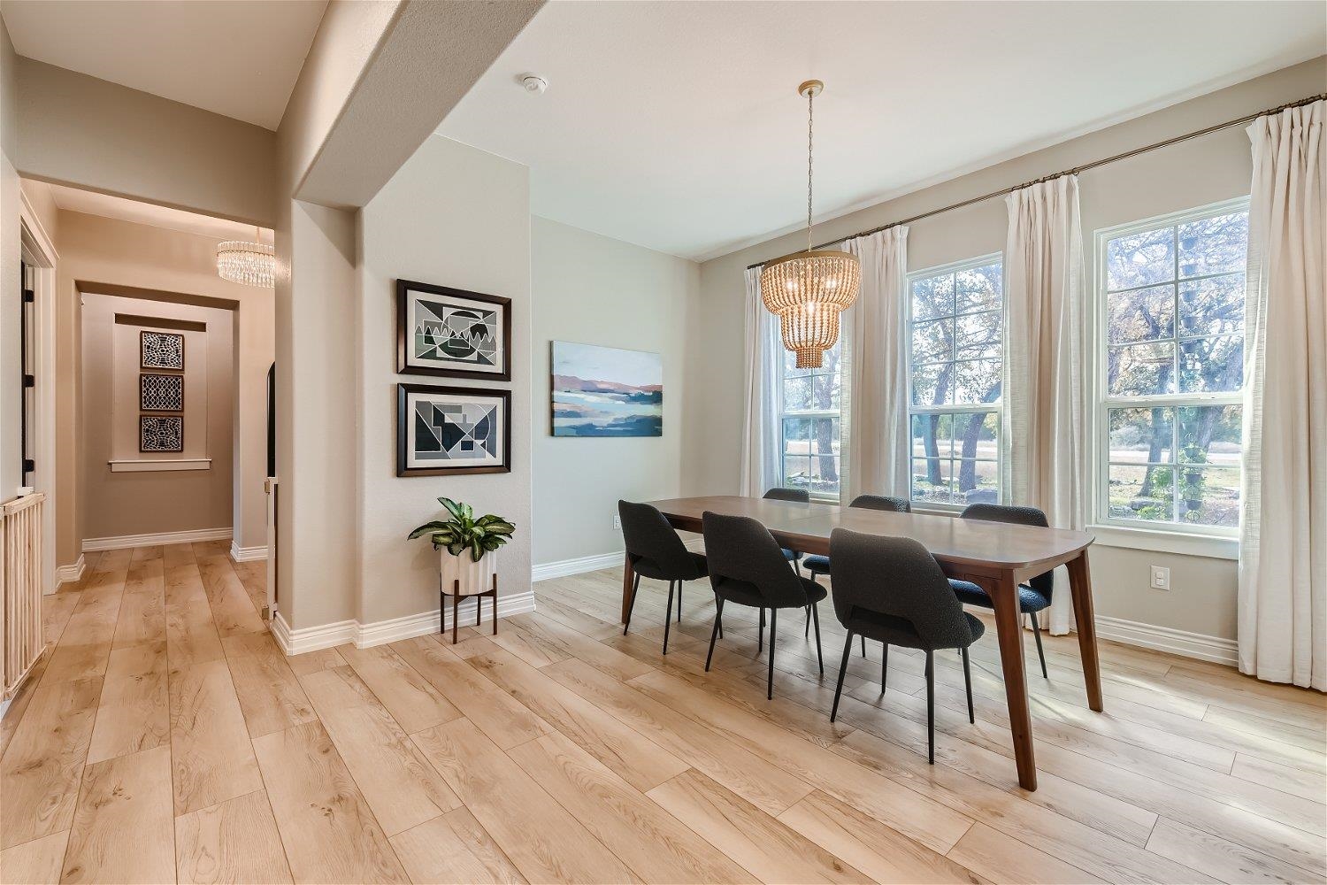 113 Vista View Trail Spicewood, TX 78669 - Photo 7 of 30 a view of a dining room with furniture window and wooden floor