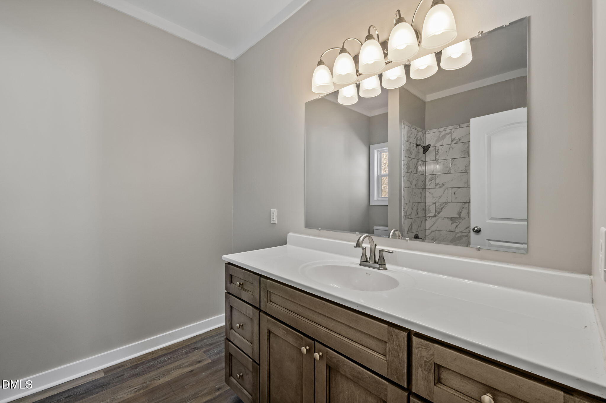 1108 Shelton Road Roxboro, NC 27573 - Photo 18 of 27 a bathroom with a sink a light fixture and a mirror