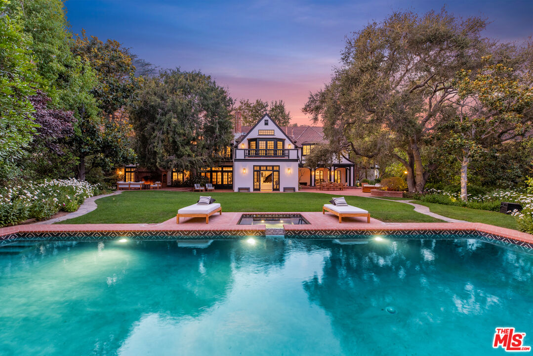 a view of building with river in front of it
