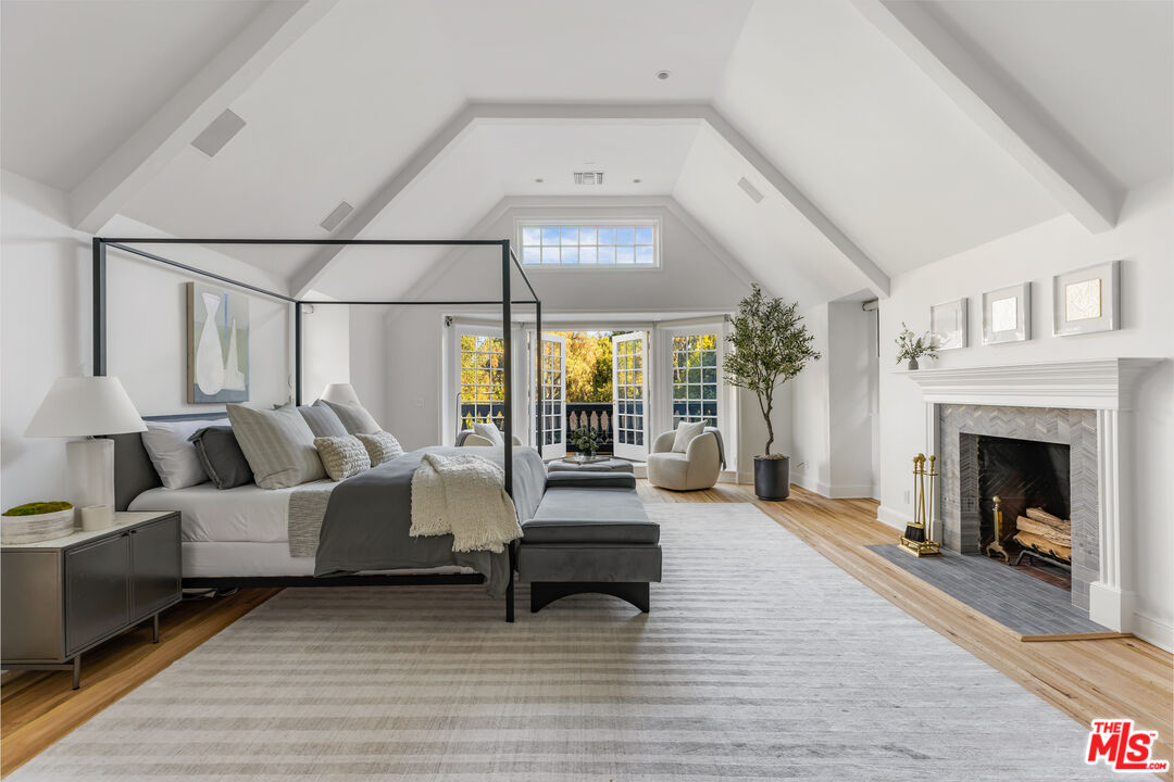 1575 Capri Drive Pacific Palisades, CA 90272 - Photo 15 of 41 a living room with furniture and a fireplace