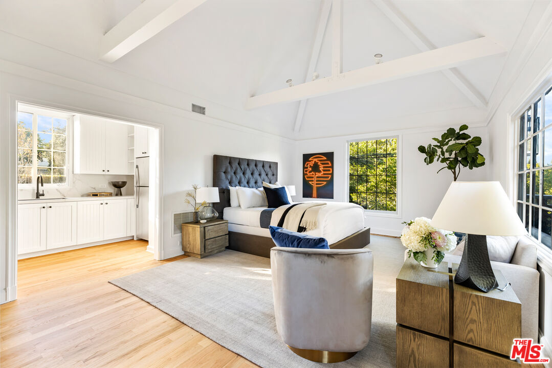 1575 Capri Drive Pacific Palisades, CA 90272 - Photo 19 of 41 a living room with furniture and a large window