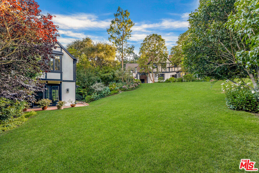 1575 Capri Drive Pacific Palisades, CA 90272 - Photo 21 of 41 a view of a house with a big yard