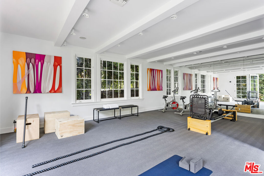 1575 Capri Drive Pacific Palisades, CA 90272 - Photo 30 of 41 a living room with furniture and a potted plant