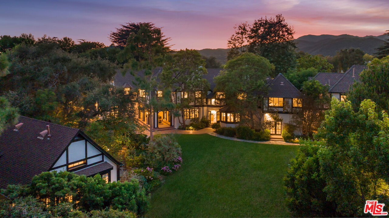 1575 Capri Drive Pacific Palisades, CA 90272 - Photo 3 of 41 a view of a garden with a house in a garden