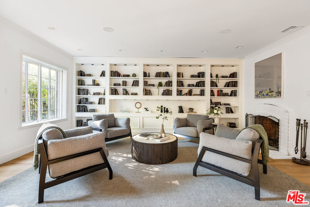 1575 Capri Drive Pacific Palisades, CA 90272 - Photo 8 of 41 a living room with furniture and a potted plant