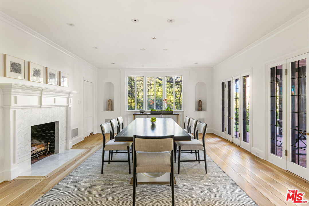 1575 Capri Drive Pacific Palisades, CA 90272 - Photo 9 of 41 a view of a dining room with furniture window and wooden floor